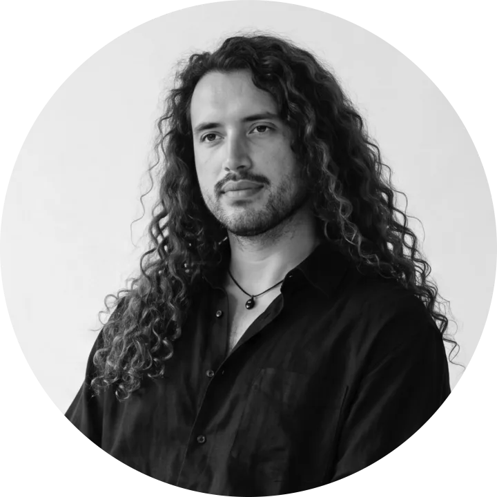 Salem Tello, smiling with long curly hair